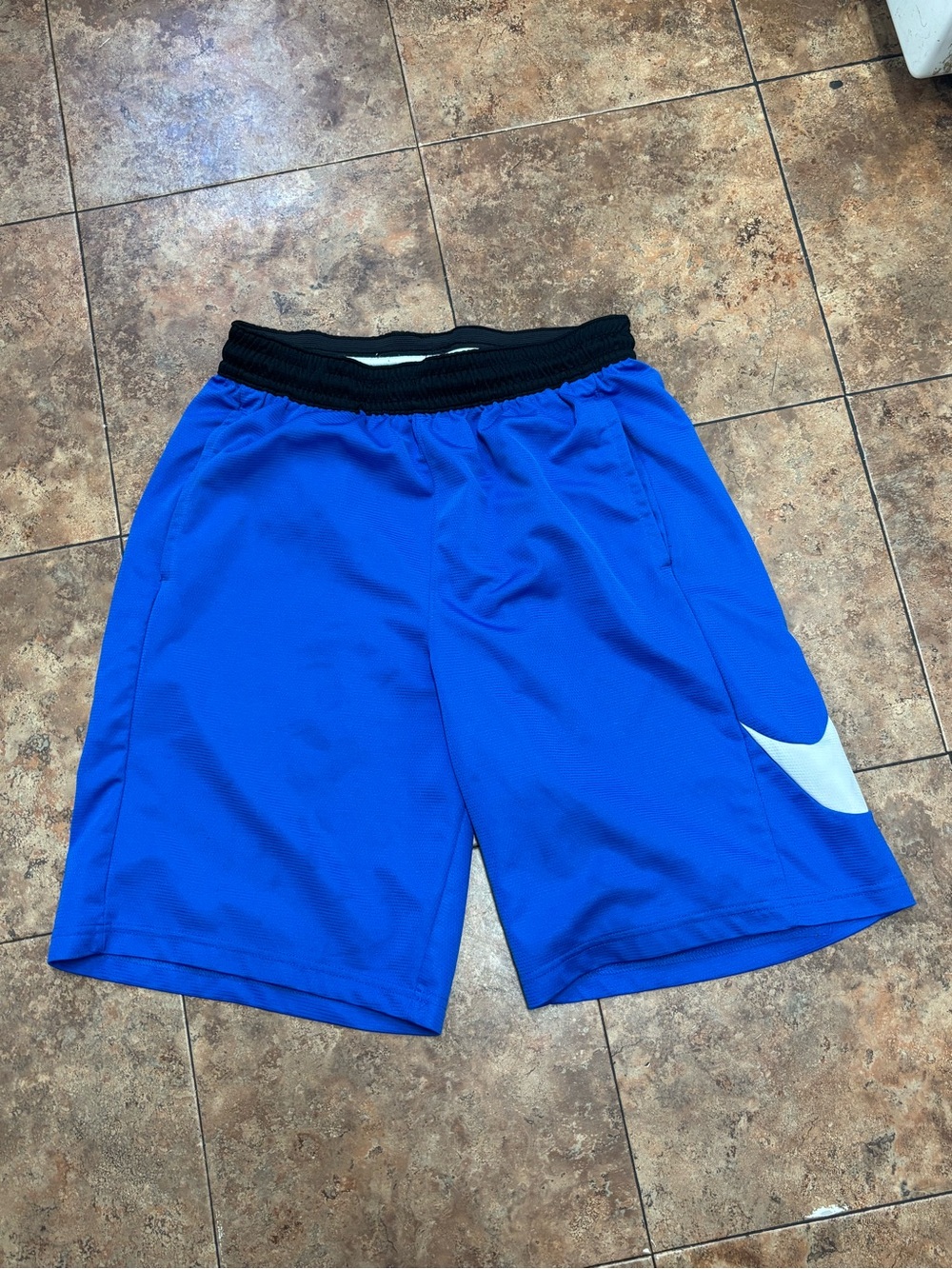 Nike Men's Blue Athletic Shorts with Black Waistband and White Swoosh